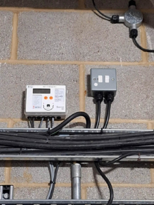 Fig 1 - Single complete heat meter with new 24V DC power installed.